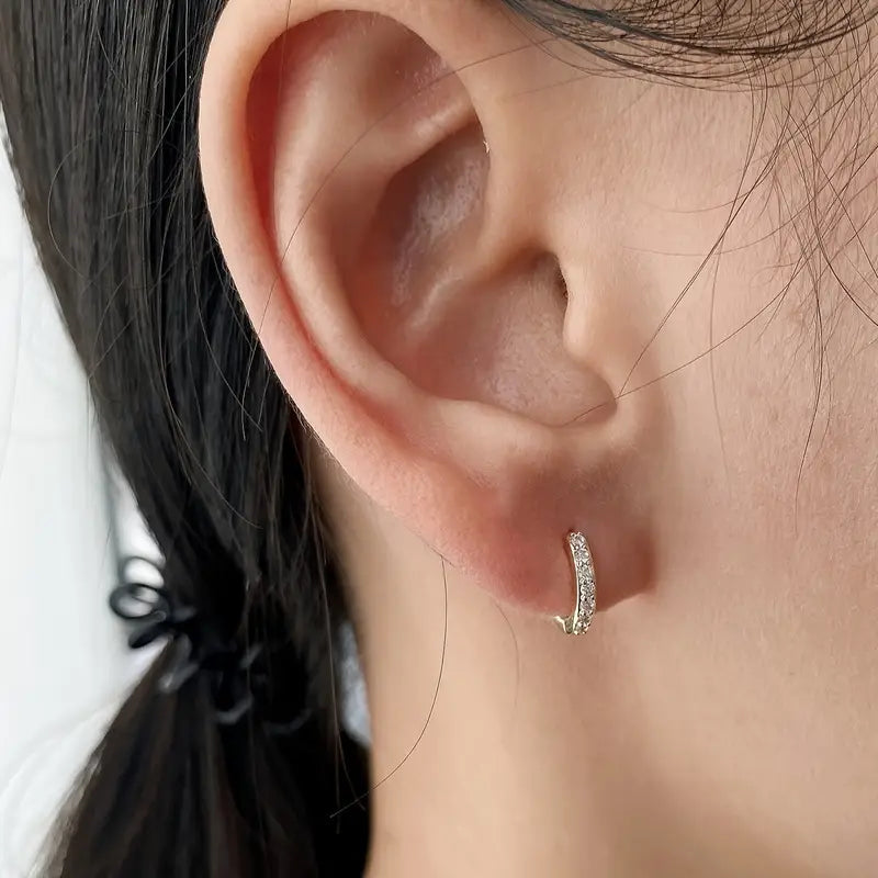 Gouden oorbellen met hangertjes in kuststijl