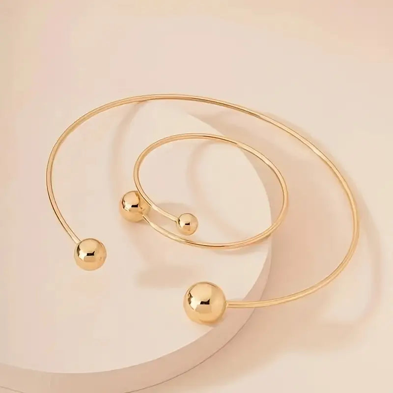 Minimalistische, lichtgevende halsband en manchetarmbandset | Goud